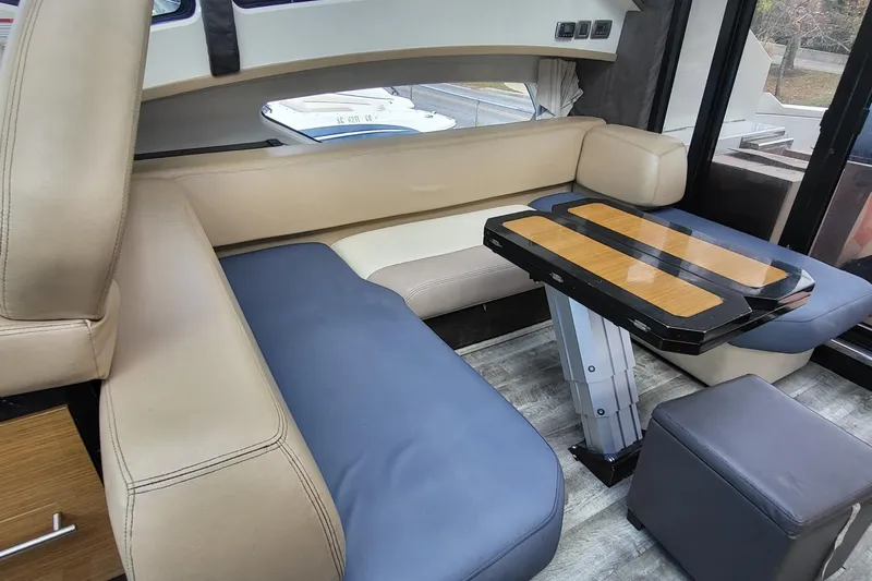  Yacht Photos Pics Luxurious interior of a 2008 Marquis 40 SC yacht with modern seating and table.