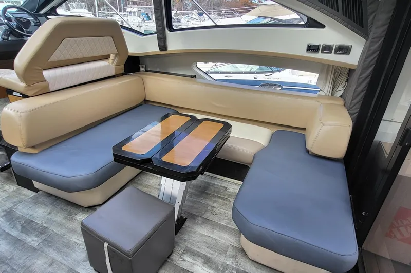  Yacht Photos Pics Luxurious interior of 2008 Marquis 40 SC yacht with plush seating and modern table design.