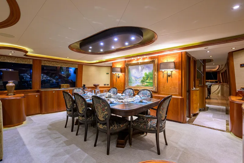 Exodus Yacht Photos Pics Luxurious dining area on 2008 Westport 112 yacht, featuring elegant decor and ambient lighting.