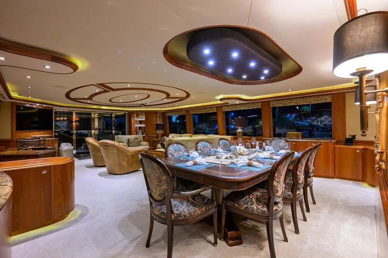 Exodus Yacht Photos Pics Luxurious interior of 2008 Westport 112 yacht with elegant dining area and plush seating.