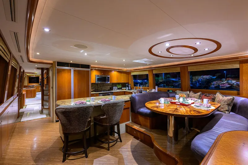 Exodus Yacht Photos Pics Luxurious interior of 2008 Westport 112 yacht with elegant dining and kitchen area.