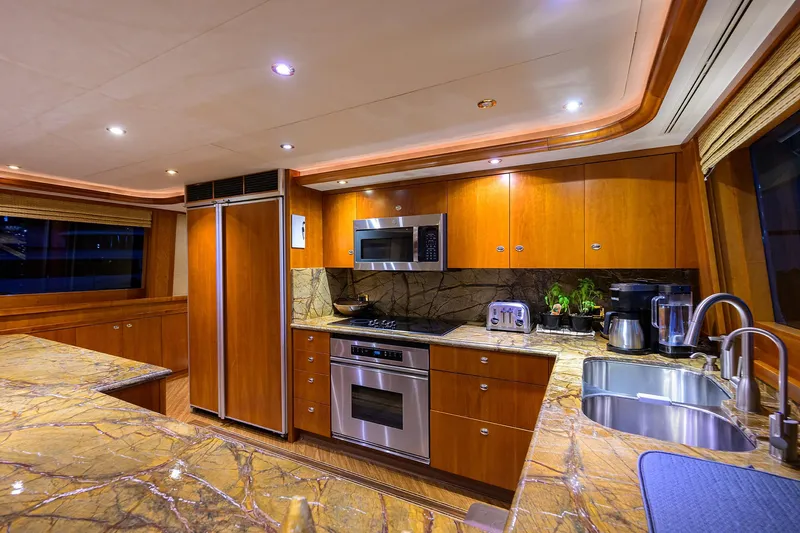 Exodus Yacht Photos Pics Luxurious kitchen interior on 2008 Westport 112 yacht with modern appliances and marble countertops.