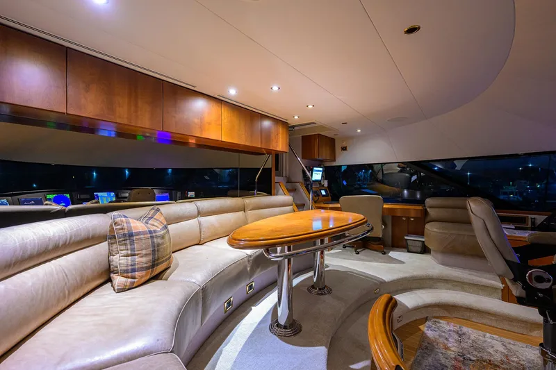 Exodus Yacht Photos Pics Luxurious interior of 2008 Westport 112 yacht with plush seating and elegant wood finishes.