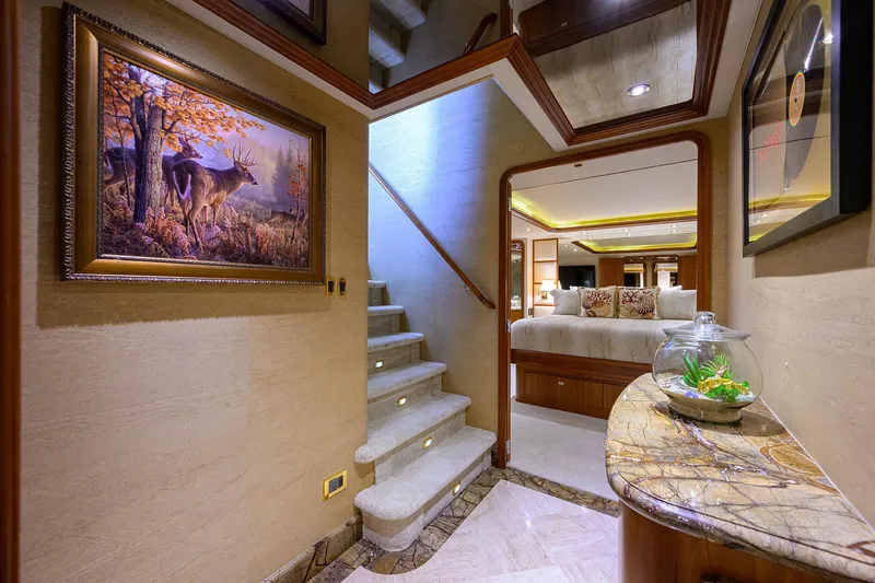 Exodus Yacht Photos Pics Luxurious interior of 2008 Westport 112 yacht with elegant staircase and artwork.