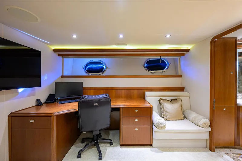 Exodus Yacht Photos Pics Luxurious office space on 2008 Westport 112 yacht with desk, chair, and seating area.