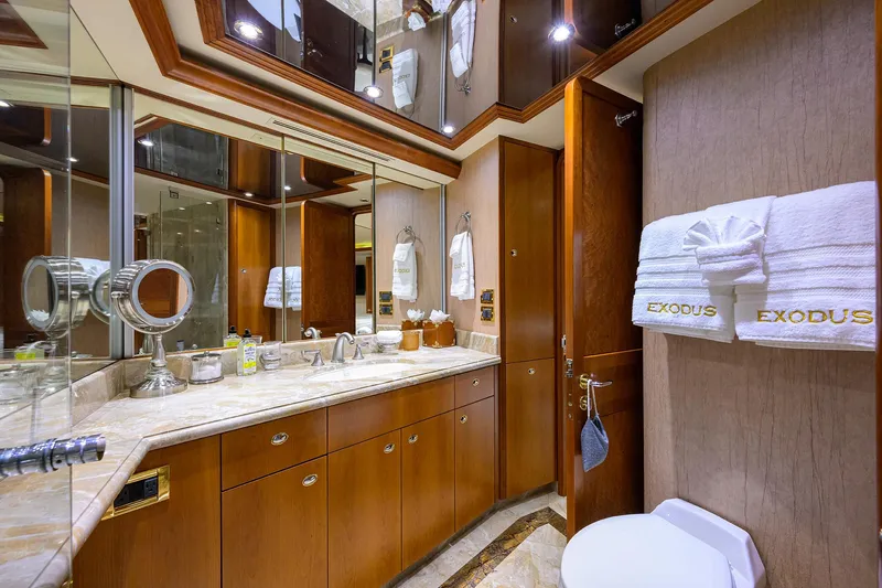 Exodus Yacht Photos Pics Luxurious bathroom on 2008 Westport 112 yacht with elegant wood cabinetry and marble countertop.