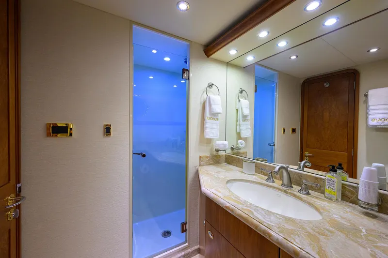 Exodus Yacht Photos Pics Luxurious bathroom in 2008 Westport 112 yacht with marble countertop and modern fixtures.