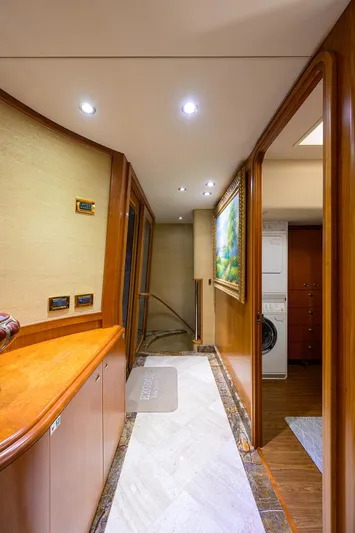 Exodus Yacht Photos Pics Luxurious hallway in 2008 Westport 112 yacht with elegant wood finishes and modern lighting.