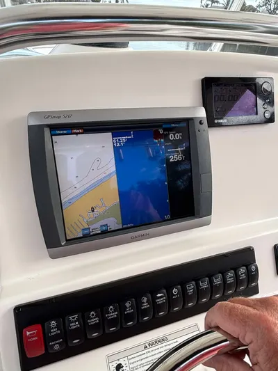  Yacht Photos Pics Edgewater 318CC 2012 boat dashboard with navigation and control panels.