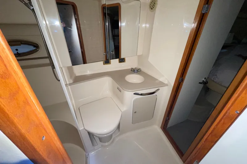 Yacht Photos Pics 2001 Sea Ray Sundancer 460 yacht bathroom with compact design and modern amenities.