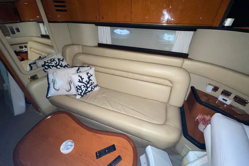  Yacht Photos Pics Luxurious interior of 2001 Sea Ray Sundancer 460 yacht with beige leather seating.
