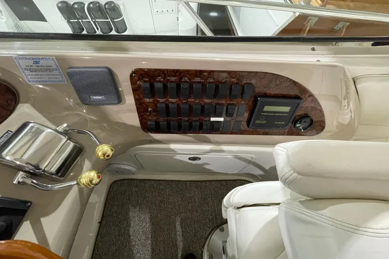  Yacht Photos Pics Control panel of a 2001 Sea Ray Sundancer 460 yacht, featuring switches and system monitor.