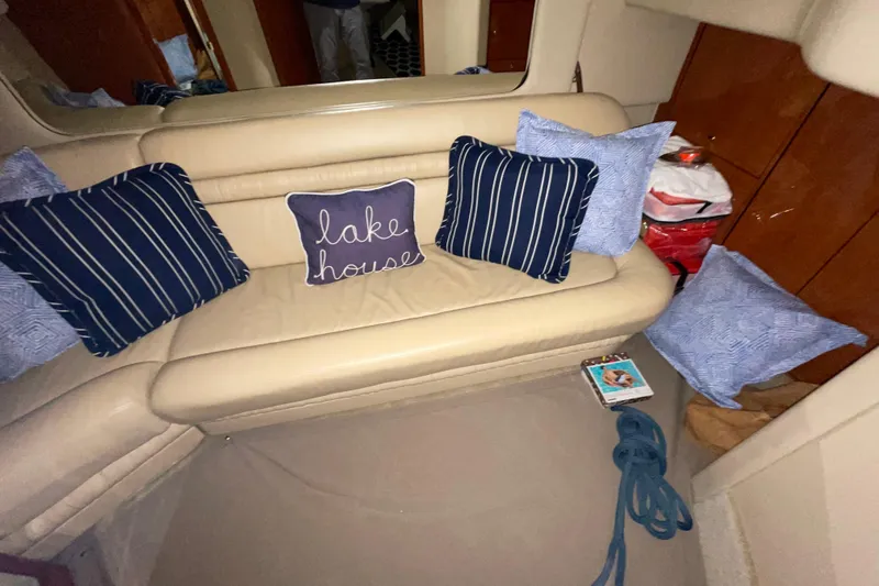  Yacht Photos Pics Interior of 2001 Sea Ray Sundancer 460 with cozy seating and decorative pillows.