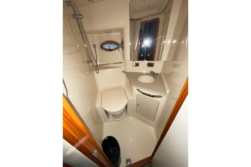  Yacht Photos Pics Bathroom interior of 2001 Sea Ray Sundancer 460 yacht, featuring shower and sink.