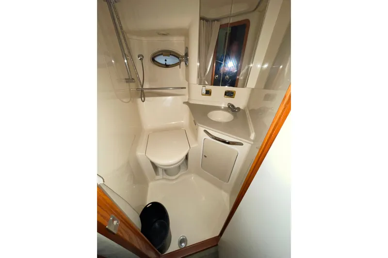  Yacht Photos Pics Bathroom interior of 2001 Sea Ray Sundancer 460 yacht, featuring shower and sink.