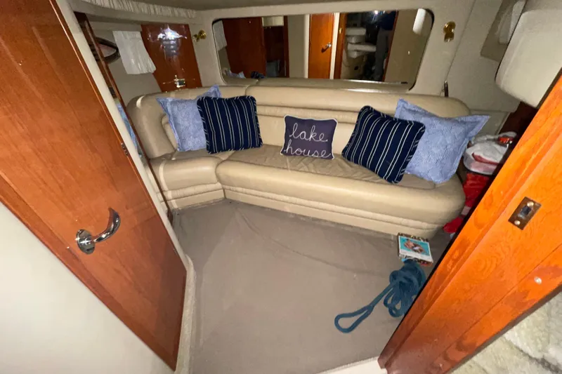  Yacht Photos Pics Interior of 2001 Sea Ray Sundancer 460 with beige seating and decorative pillows.