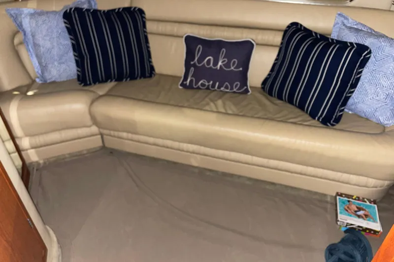  Yacht Photos Pics Interior of 2001 Sea Ray Sundancer 460 with cozy cushions and "lake house" pillow.