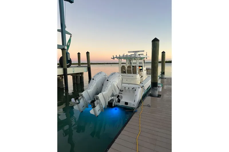  Yacht Photos Pics 2020 Everglades 335 Center Console boat docked at sunset with dual engines.