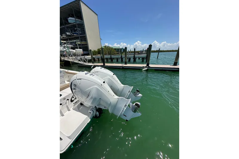 Yacht Photos Pics 2020 Everglades 335 Center Console boat with dual outboard engines docked.
