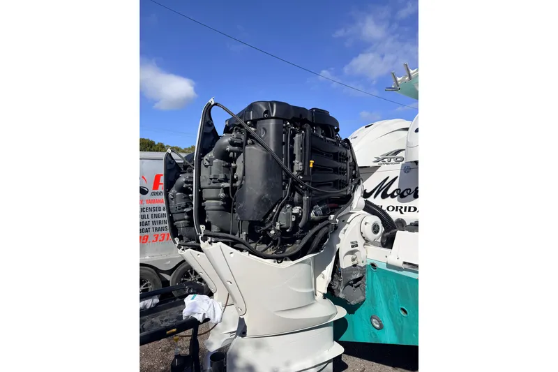  Yacht Photos Pics 2020 Everglades 335 Center Console boat engine, detailed view under blue sky.