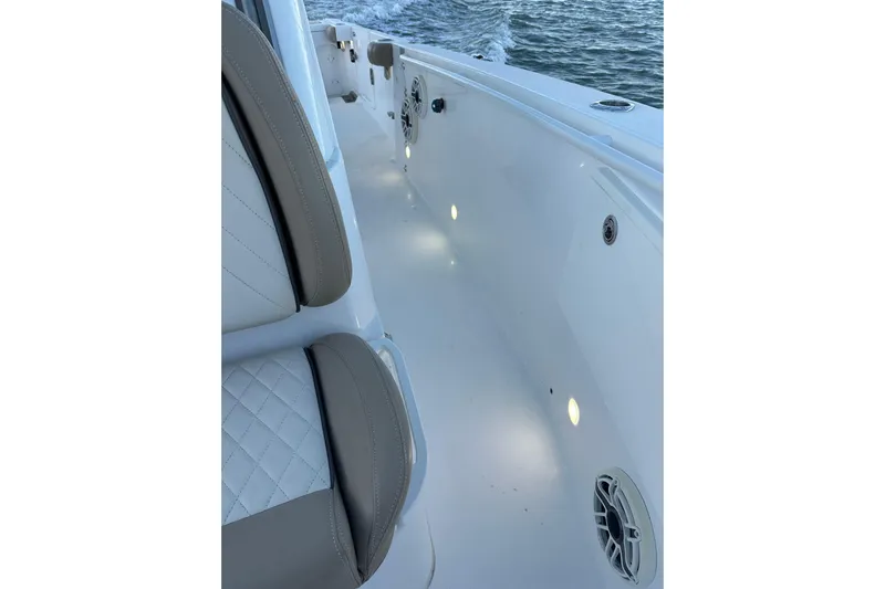  Yacht Photos Pics 2020 Everglades 335 Center Console boat interior with cushioned seating and deck lighting.
