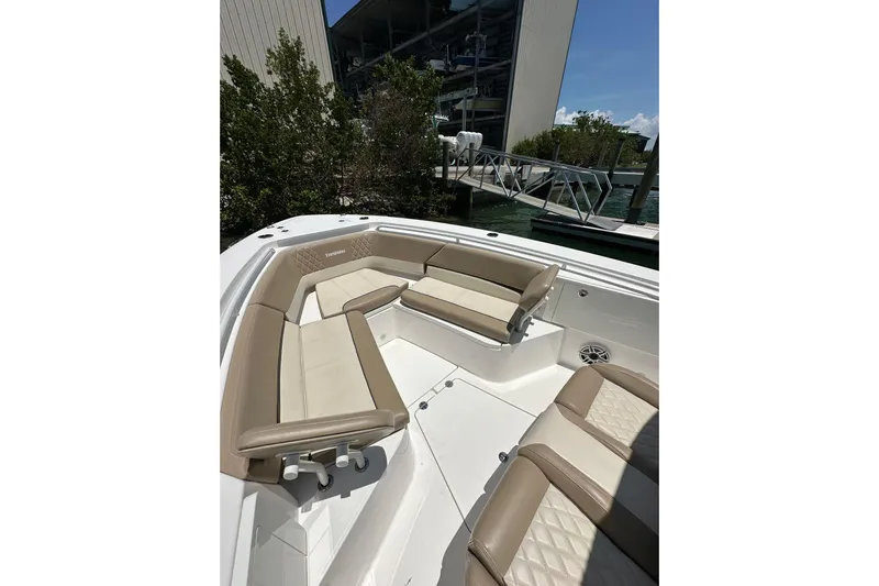 Yacht Photos Pics 2020 Everglades 335 Center Console boat with beige seating and spacious deck.
