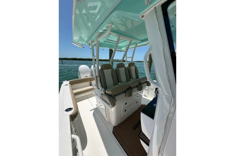  Yacht Photos Pics 2020 Everglades 335 Center Console boat interior with cushioned seating and ocean view.