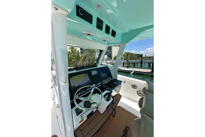  Yacht Photos Pics 2020 Everglades 335 Center Console boat interior with advanced navigation system and steering wheel.