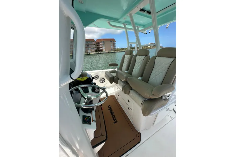  Yacht Photos Pics 2020 Everglades 335 Center Console boat interior with luxurious seating and steering wheel.