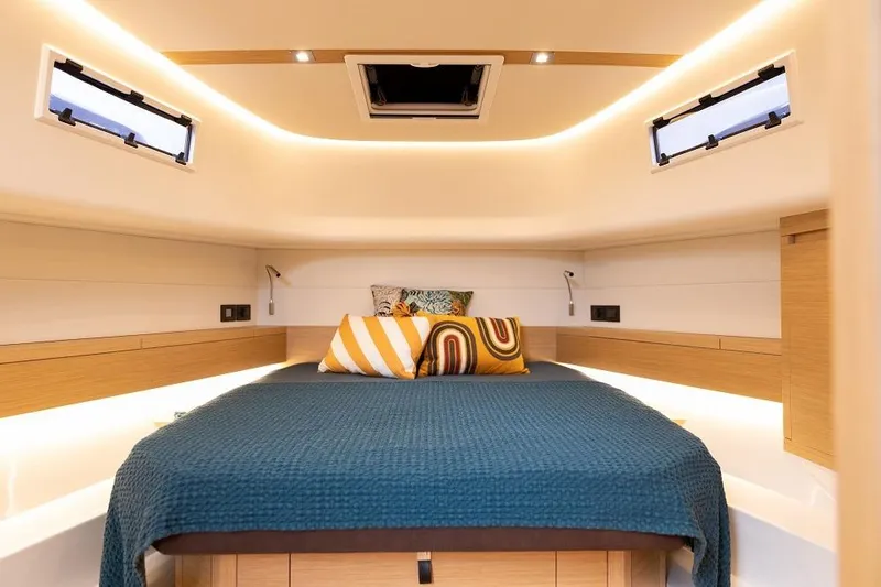 Sirocco Yacht Photos Pics Luxurious cabin interior of 2021 Pardo Yachts 43 with modern design and cozy bedding.