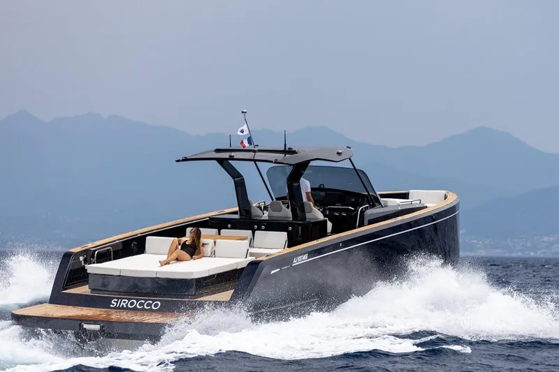 Sirocco Yacht Photos Pics 2021 Pardo Yachts 43 cruising on open water with mountains in the background.