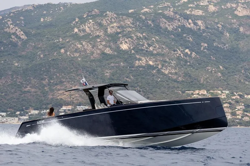 Sirocco Yacht Photos Pics 2021 Pardo Yachts 43 cruising on water with scenic mountain backdrop.