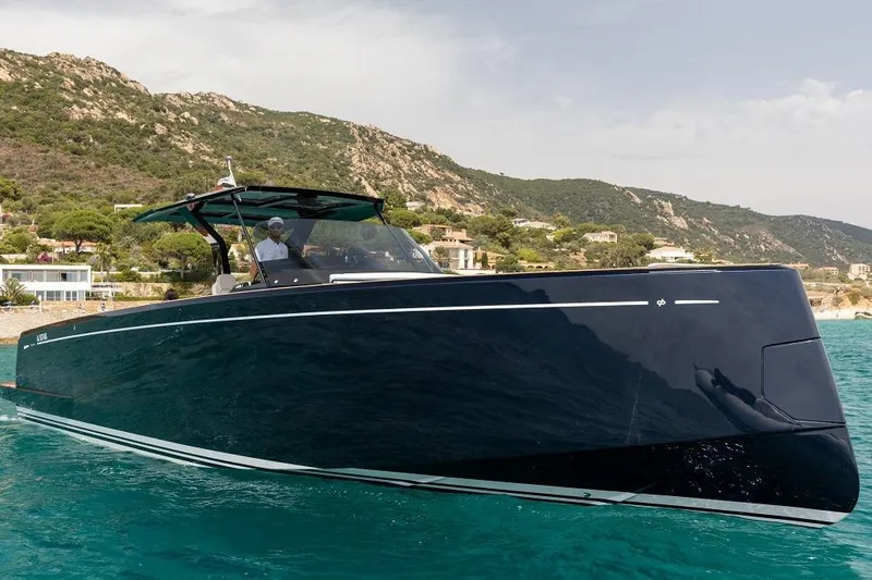 Sirocco Yacht Photos Pics 2021 Pardo Yachts 43 cruising in clear blue waters near a scenic coastline.
