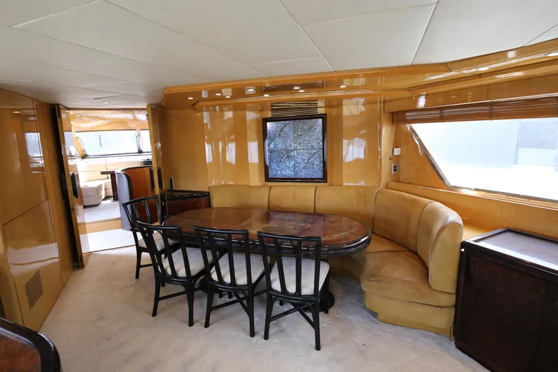  Yacht Photos Pics Luxurious interior of a 1990 Sanlorenzo 80 yacht with elegant dining area.