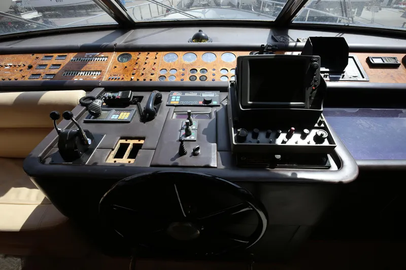  Yacht Photos Pics Cockpit of 1990 Sanlorenzo 80 yacht with navigation controls and instruments.