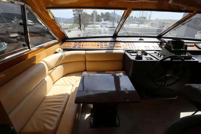  Yacht Photos Pics Luxurious interior of a 1990 Sanlorenzo 80 yacht with leather seating and control panel.
