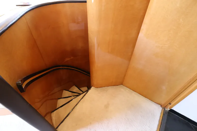 Yacht Photos Pics Curved wooden staircase inside 1990 Sanlorenzo 80 yacht.