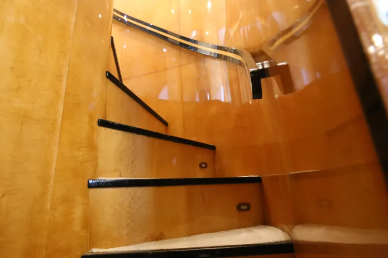  Yacht Photos Pics Luxurious wooden staircase inside a 1990 Sanlorenzo 80 yacht.
