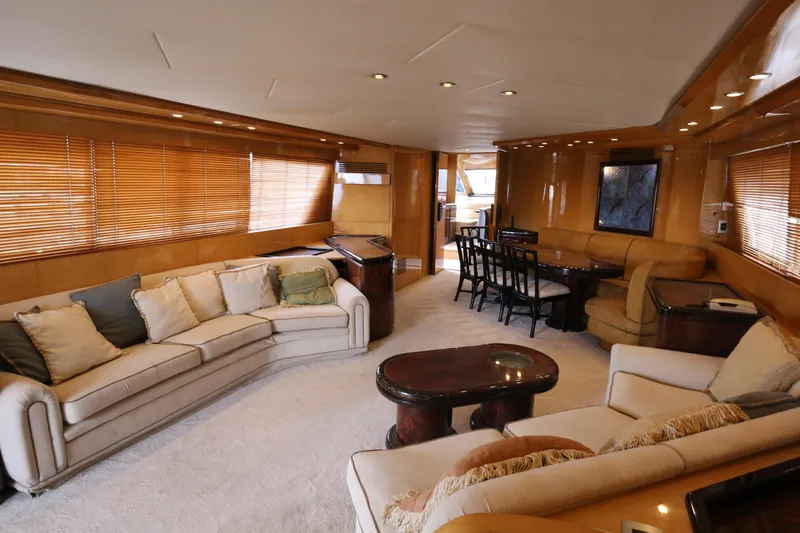  Yacht Photos Pics Luxurious interior of a 1990 Sanlorenzo 80 yacht with elegant seating and dining area.