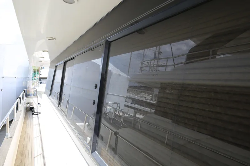  Yacht Photos Pics Sanlorenzo 80 yacht exterior, 1990 model, featuring sleek windows and a spacious deck walkway.