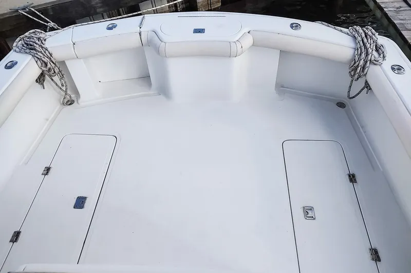 Never Enough Yacht Photos Pics 2017 Out Island SeaTek 36 Express boat deck with storage hatches and ropes.