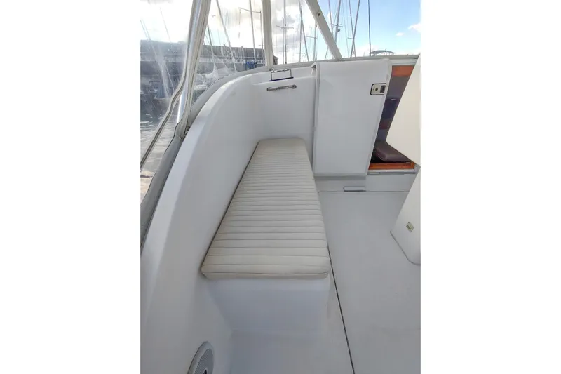 Never Enough Yacht Photos Pics 2017 Out Island SeaTek 36 Express boat interior with cushioned seating and sleek design.