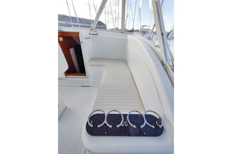 Never Enough Yacht Photos Pics 2017 Out Island SeaTek 36 Express boat interior with cushioned seating and cup holders.