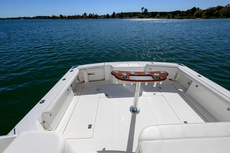 Ghost Yacht Photos Pics 2013 Cabo 40 Hardtop Express boat deck overlooking serene water and distant shoreline.