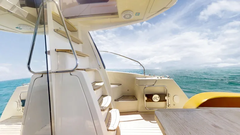  Yacht Photos Pics 2016 Monte Carlo Yachts MC5 deck with stairs, ocean view, and clear sky.