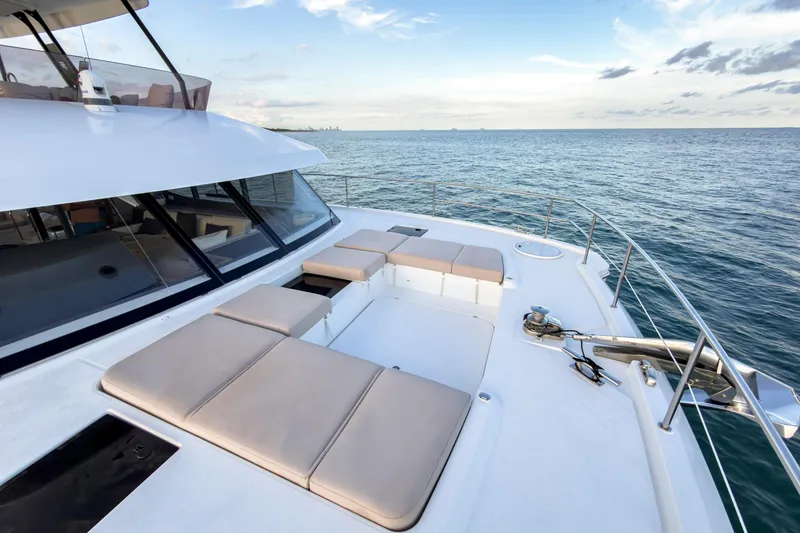 Hawkeye Yacht Photos Pics Fountaine Pajot MY6 2022 yacht deck with sun loungers on the sea.