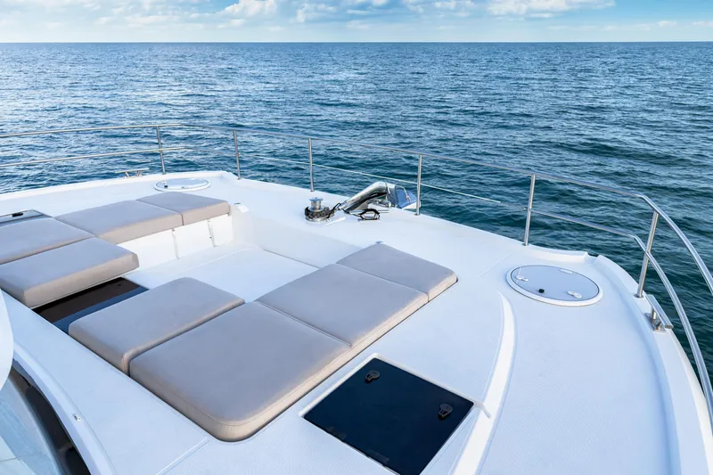 Hawkeye Yacht Photos Pics 2022 Fountaine Pajot MY6 yacht deck with sun loungers on open sea.