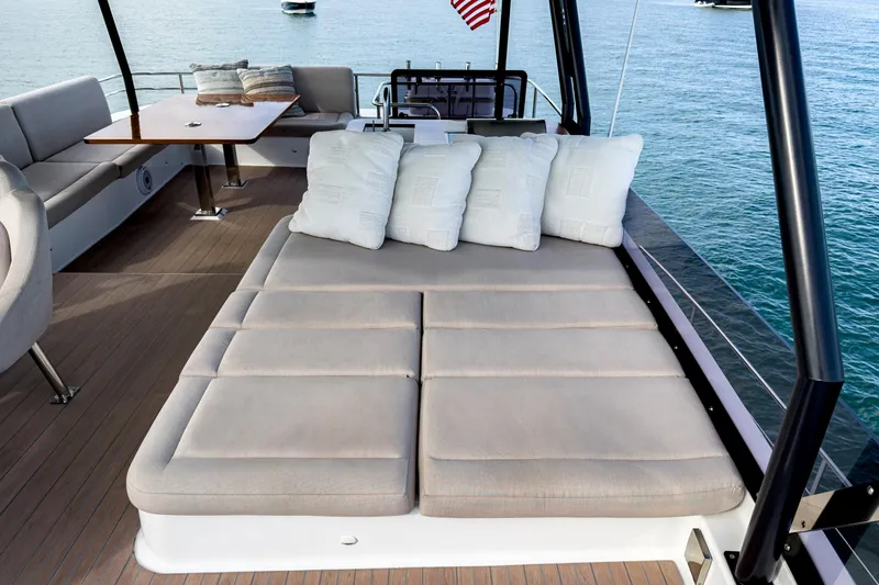 Hawkeye Yacht Photos Pics Luxurious 2022 Fountaine Pajot MY6 yacht deck with cushioned seating and ocean view.