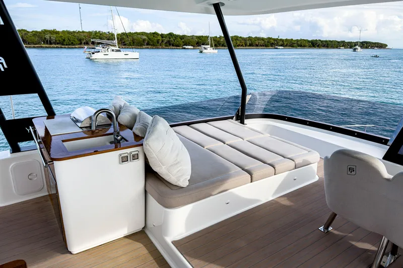 Hawkeye Yacht Photos Pics Luxurious 2022 Fountaine Pajot MY6 yacht interior with sunbed and ocean view.