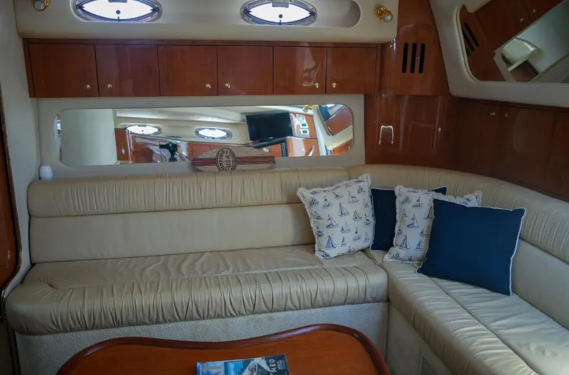  Yacht Photos Pics Luxurious interior of a 2001 Sea Ray Express Cruiser with plush seating and nautical decor.